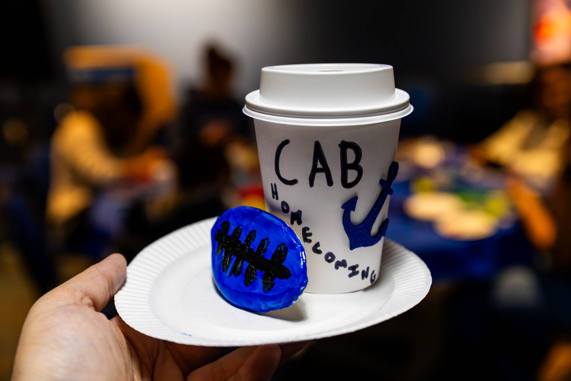 coffee cup that reads GVSU homecoming